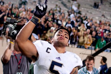 image: Notre Dame linebacker Manti Te'o points to the sky as he leaves the field after a 20-3 win against Michigan State in East Lansing, Mich., Sept. 15, 2012.