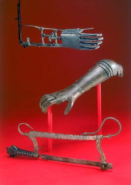 Amputation saw and two artificial arms, 16th century.