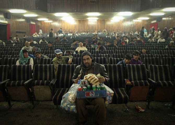 An employee of Cinema Pamir sells refreshments during the movie interval in Kabul
