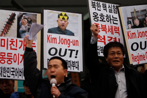 Activists from anti-North Korea civic group chant slogans during a rally against North Korea's nuclear test near the U.S. embassy in central Seoul