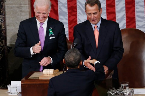 U.S. Vice President Biden gives a thumbs up as President Obama shakes hands with House Speaker Boehner prior to delivering his State of the Union Speech on Capitol Hill in Washington