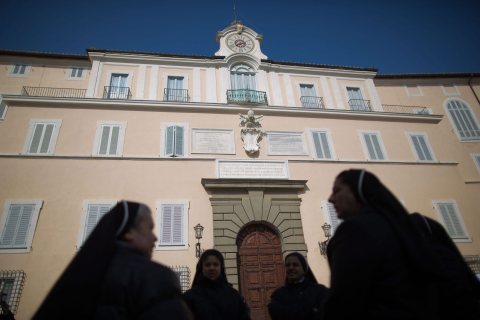 Nuns stand in front of the Apostolic Palace in Castel Gandolfo, Italy, on Feb. 28, 2013. 