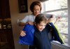 Sheirn Adi helps her son Bilal put on a bullet proof vest backpack combination called the V-Bag sold by Elite Sterling Security LLC in Aurora