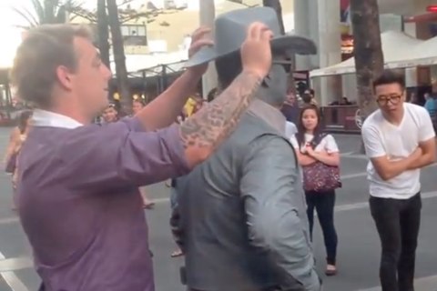 Street performer punches guy 