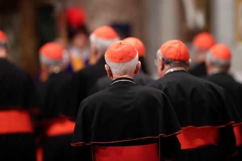 Cardinals leave at the end of a prayer at Saint Peter's Basilica in the Vatican