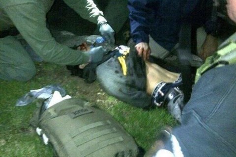 Handout photo of Dzhokhar Tsarnaev being searched by law enforcement officers