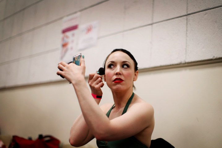 A dancer adjusts her makeup as she waits to audition to join the world famous Rockettes in New York City