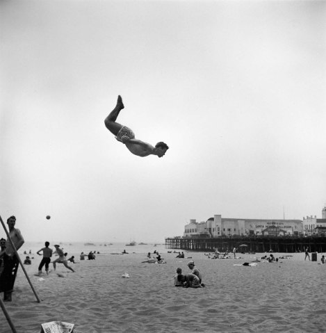 A man flies off a trampoline at Santa Monica Beach, Calif., on July 1, 1948.