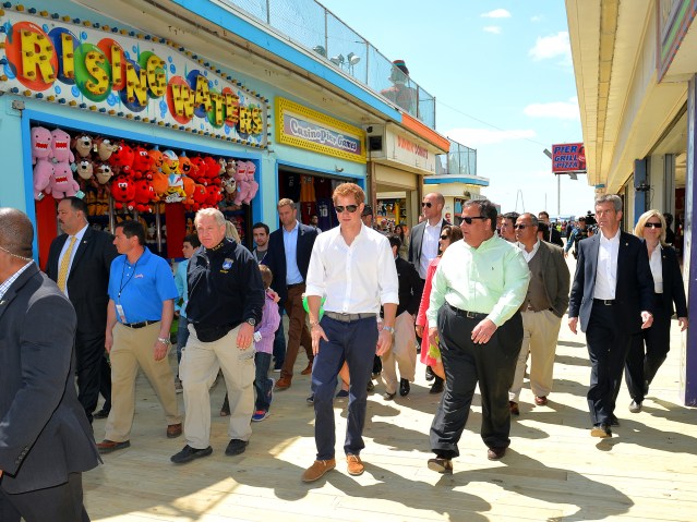 From left: Prince Harry and Governor Chris Christie on the Pier at Seaside Heights, New Jersey during his visit to Mantoloking, one of the areas affected by Superstorm Sandy, on May 14, 2013.