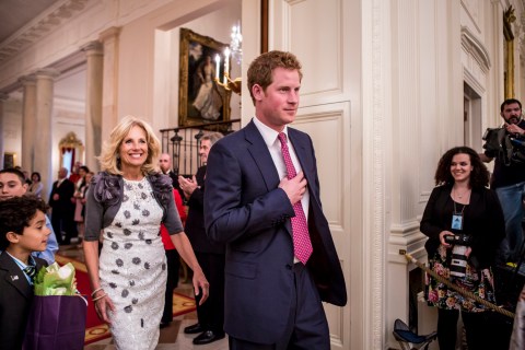 From left: Dr. Jill Biden, and Prince Harry attend a Joining Forces Mother's Day Tea at the White House in Washington, D.C., on May 9, 2013.