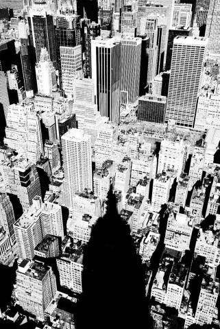 The shadow of the Empire State Building falls over New York City.