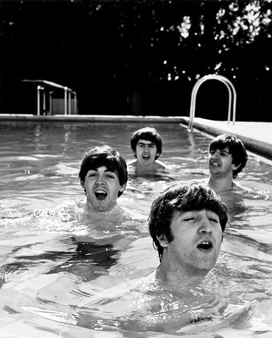 From left: Paul McCartney, George Harrison, John Lennon and Ringo Starr of the Beatles, taking a dip in a swimming pool.