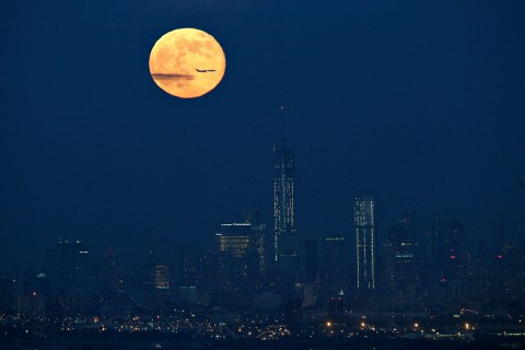 A full moon also referred to as a super moon rises over New York as seen from West Orange, New Jersey