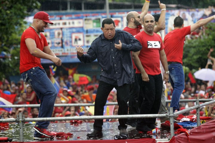 Venezuela's former President Hugo Chavez dances after speaking at his closing campaign rally in Caracas, on Oct. 4, 2012.