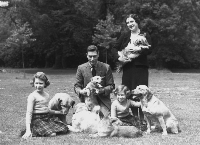King George VI (1895 - 1952) and Queen Elizabeth with Princesses Margaret Rose (1930 - 2002) and Elizabeth, left, in the grounds of Windsor Castle, Berkshire.