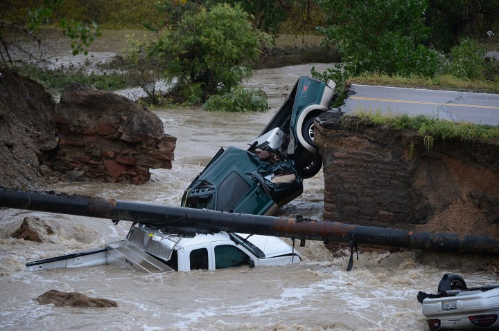 Three vehicles crashed into a creek after the road washed out from beneath them near Dillon Rd. and 287 in Broomfield Colorado, September 12, 2013.