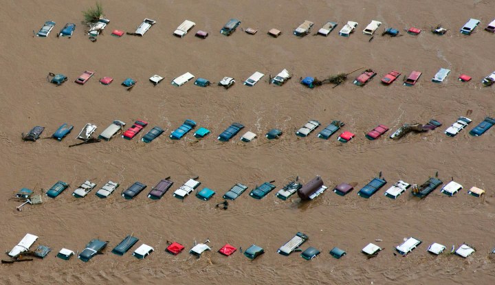 An aerial view of vehicles submerged in flood waters along the South Platte River near Greenley, Colo., on Sept. 14, 2013. 