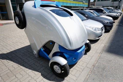 Armadillo-T, a foldable electric vehicle, folds up its rear at the Korea Advanced Institute of Science and Technology in Daejeon