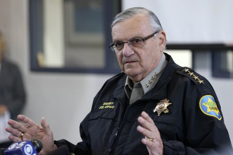 Maricopa County Sheriff Joe Arpaio watches as actor Steven Seagal addresses the media about a simulated school shooting in Fountain Hills