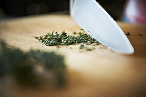 Knife cutting herbs