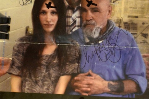 An autographed photo of Charles Manson, far right, and friends Graywolf, center, and Star, left on July 31, 2013.
