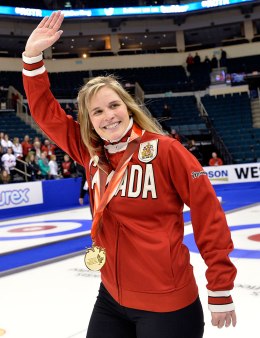 Skip Jennifer Jones waves to the crowd after defeating Team Middaugh during the women's final at the Roar of the Rings Canadian Olympic Curling Trials in Winnipeg, Dec. 7, 2013.