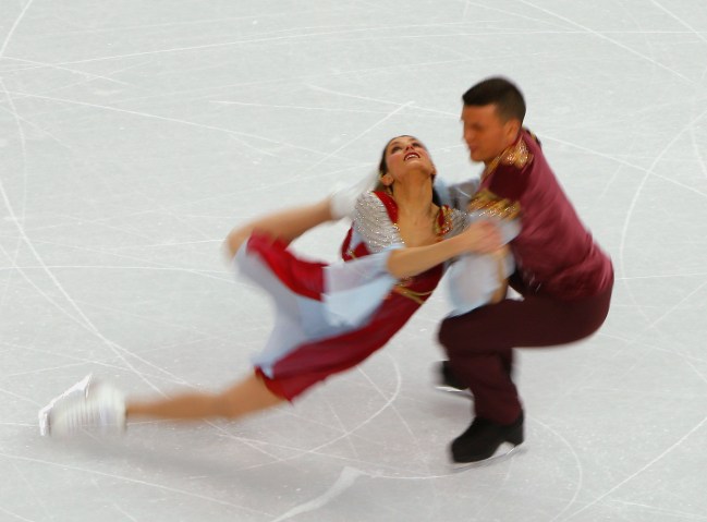 Charlene Guignard, left, and Marco Fabbri of Italy compete during the figure skating team ice dance free dance Feb. 9, 2014.
