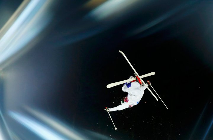 Finland's Arttu Kiramo performs jump during men's freestyle skiing moguls qualification round at 2014 Sochi Winter Olympic Games in Rosa Khutor
