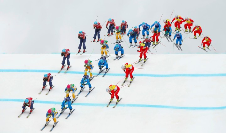 Sweden's Holmlund, Canada's Serwa, Austria's Ofner and Switzerland's Smith competes during women's freestyle skiing skicross semi-finals at 2014 Sochi Winter Olympic Games in Rosa Khutor